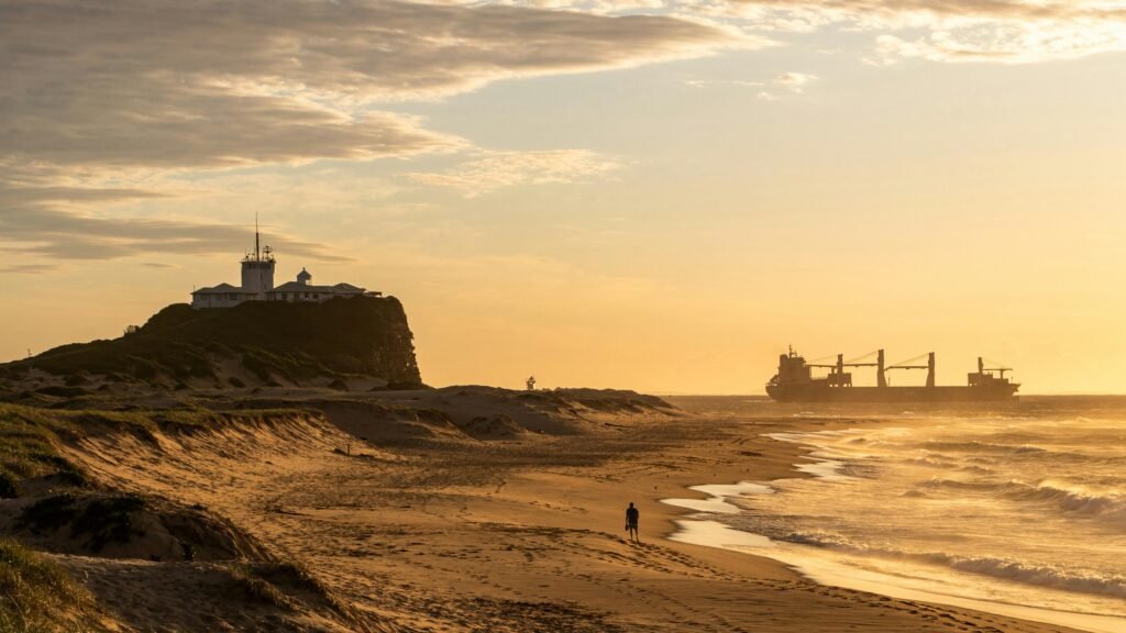 View of the Nobbys Beach and Nobbys Lighthouse at Sunset in Newcastle, Australia